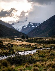 Mountainous landscape with a river and cloudy skies at dusk