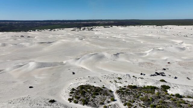 Aerial view of the stark white dunes contrasting against the darker green vegetation in the background, Lancelin, Western Australia, Australia.