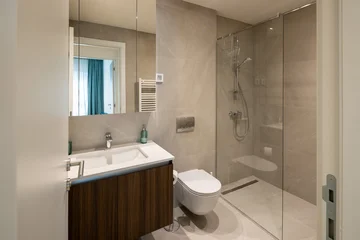 Fotobehang Hotel chique Interior of a luxury hotel bathroom with glass shower cabin  © rilueda