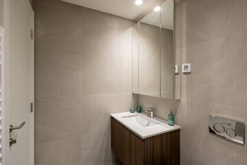 Interior of a hotel bathroom with a  mirror