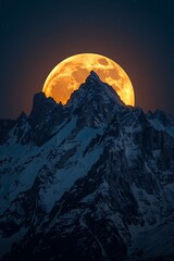 Dramatic full moon rising behind jagged mountain peaks at night