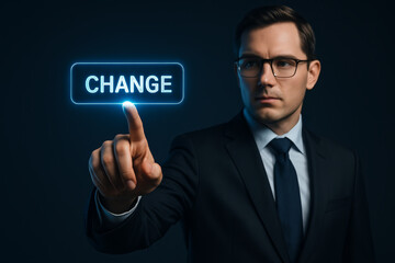 Serious man touches change button for ai driven business growth pointing to future innovation and technology