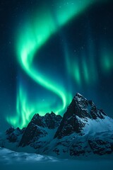 Vibrant green aurora borealis dances over a snow covered mountain peak