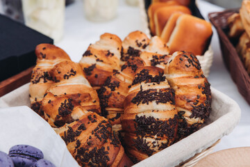 Set of coffee break in the hotel during conference meeting, with tea and coffee catering, decorated catering banquet table with variety of different pastry and bakery, with croissants, pie and cookies