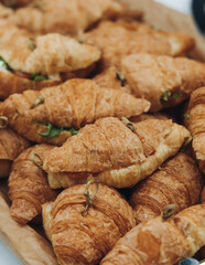 Set of coffee break in the hotel during conference meeting, with tea and coffee catering, decorated catering banquet table with variety of different pastry and bakery, with croissants, pie and cookies