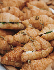 Set of coffee break in the hotel during conference meeting, with tea and coffee catering, decorated catering banquet table with variety of different pastry and bakery, with croissants, pie and cookies