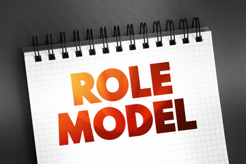 Role Model - person whose behaviour, example, or success is or can be emulated by others, text on notepad, concept background