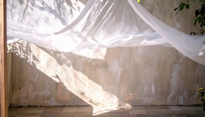 White Sheer Fabric Draped Against a Textured Wall