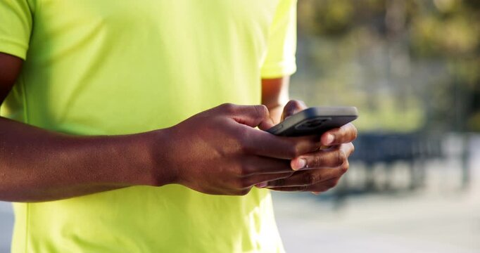 Tennis, sports and hands of man with phone for social media, typing message and fitness app. Outdoor court, athlete and person on smartphone for connection after workout, exercise and practice