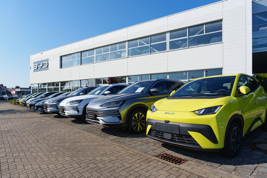 Dusseldorf, Germany - September 28 2025: Row of new BYD cars parked outside of a dealership