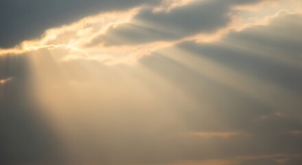 Obraz premium Dramatic sunbeams pierce through cloudy sky creating a sense of hope and divine intervention