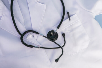 A top view of a doctor coat and a stethoscope