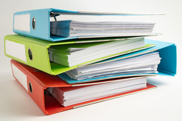 Stack of business finance data finder on white background.