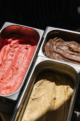 Set of three types of ice cream in containers
