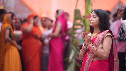 Women doing namaskar to Sun God during Chhath Puja.