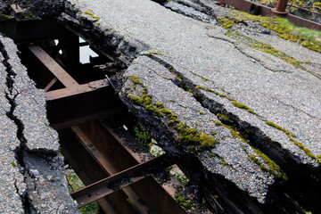 An old, destroyed road on a bridge