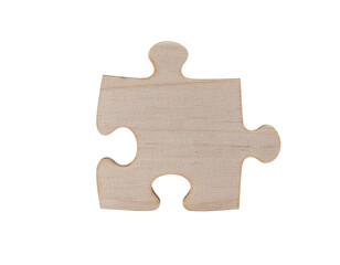 Fototapeta premium A single wooden puzzle piece, featuring unique interlocking edges and a smooth, light-colored surface.