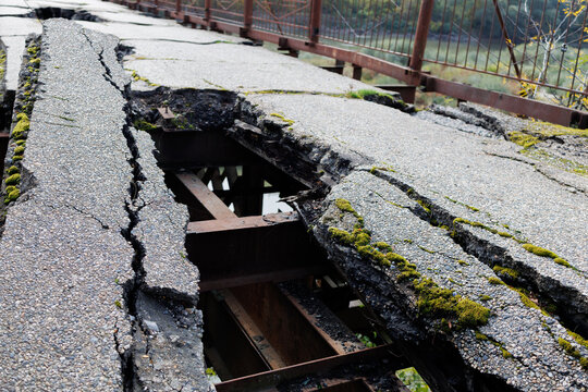 An old, destroyed road on a bridge