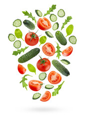 Bright vegetable salad ingredients - red tomato, green cucumbers, greens -  fly or fall as flow art composition, isolated. Wholesome, vitamin ingredient for antioxidant salads, healthy dietary menus.
