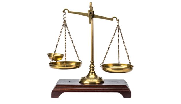 Brass scales slightly tilted, atop a dark wood base