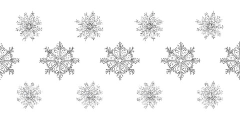 Isolated snowflakes in intricate detail are showcased in a symmetrical row against a pristine white background, providing a wintery and minimalist aesthetic.