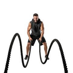 A muscular man in a black hoodie and shorts performing battle ropes on a , against transparent background