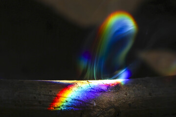 Mysterious abstract background showing vibrant spectrum of rainbow light. This colorful prism...