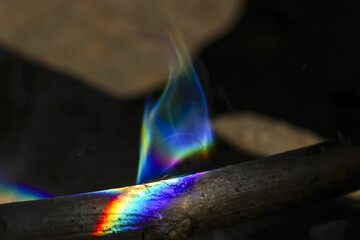 Close up of mesmerizing colorful flame with beautiful rainbow spectrum of light. This abstract...