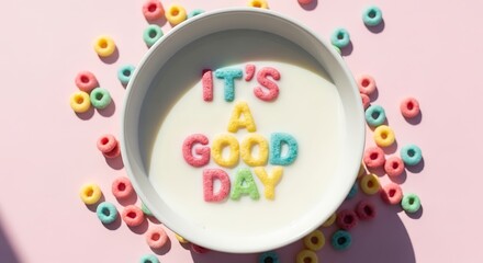 Breakfast bowl containing colorful alphabet cereal floating in white liquid spells out an encouraging phrase