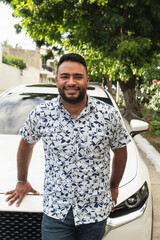 Happy man smiling, celebrating new car purchase