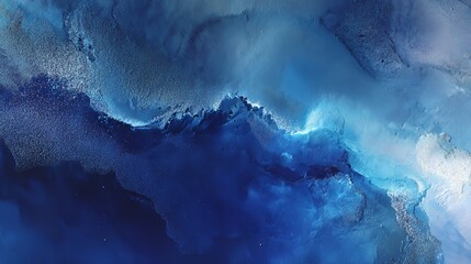 Abstract blue and white swirling texture resembling ocean waves or cosmic nebulae with sparkling details