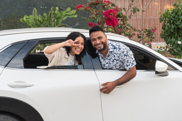 Happy young couple traveling road trip and smiling