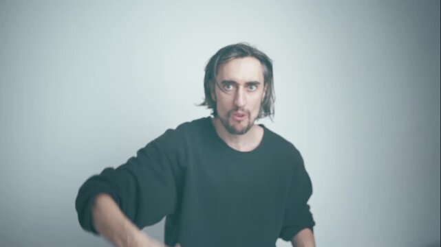 Like, Cool, Thumbs Up: Male figure transforms from introspective to confident, displaying animated gestures and serious expressions against a soft pale background.