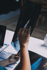 Group of doctors attending seminar in hospital lecture hall with senior physician giving medical...