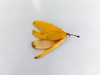 Yellow Banana Peel isolated on a clean white background. This Banana Peel photo is great for food waste or organic concepts.