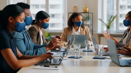 Business team wearing face masks during corporate meeting - Powered by Adobe