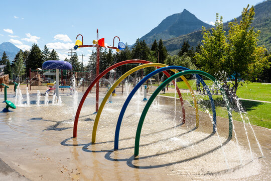 Vibrant splash pad featuring colorful arches and playful water features.