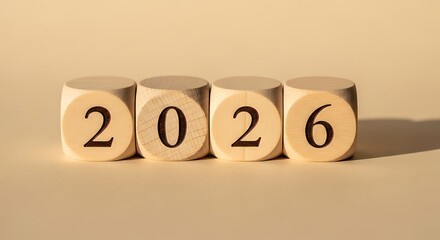 Wooden dice displaying the year 2026, representing future planning and upcoming events.