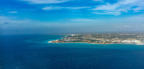 Aerial View of Aruba Island with Turquoise Waters, White Sand Beaches, and Coastal Resorts in the Caribbean Sea