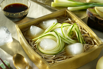 Cold soba noodles with ice cubes create refreshing summer dish, perfect for warm days