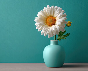 White daisy flower with yellow center in blue vase on teal
