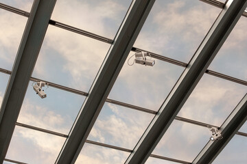 Ceiling surveillance with sky in the background