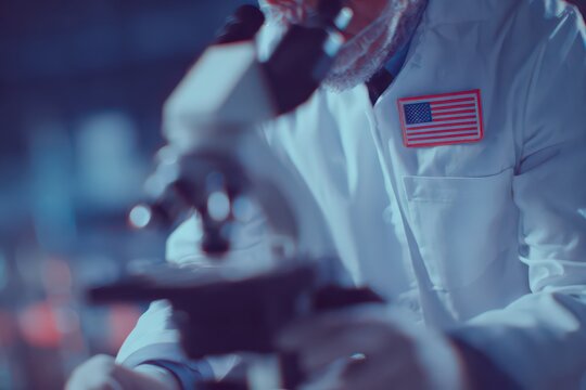 Microscope work in USA laboratory showcasing a scientist dedicated to research and innovation while proudly displaying the American flag on their lab coat - Powered by Adobe