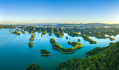 Aerial view of the beautiful lake and green mountain natural landscape at sunrise. Famous Qiandao...
