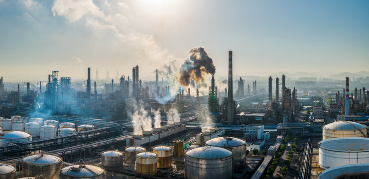 Aerial view of the oil refinery and chemical plant with smoking chimneys in a large industrial area