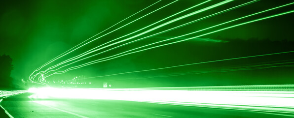 green car lights at night. long exposure