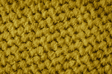 yellow braided material with an interesting pattern
