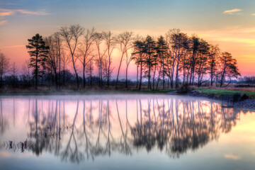 sunrise over foggy lake