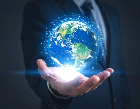 Person holding a glowing digital earth in their open palm