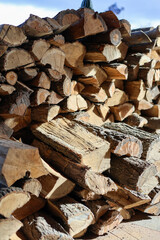 Preparing firewood for the winter. Oak timber.  Heating with the wood.